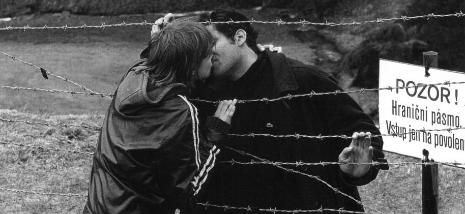 Kiss through barbed wire.